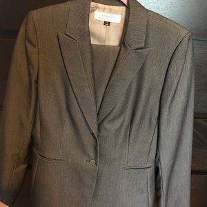 Two piece navy blue/strip pants suit.